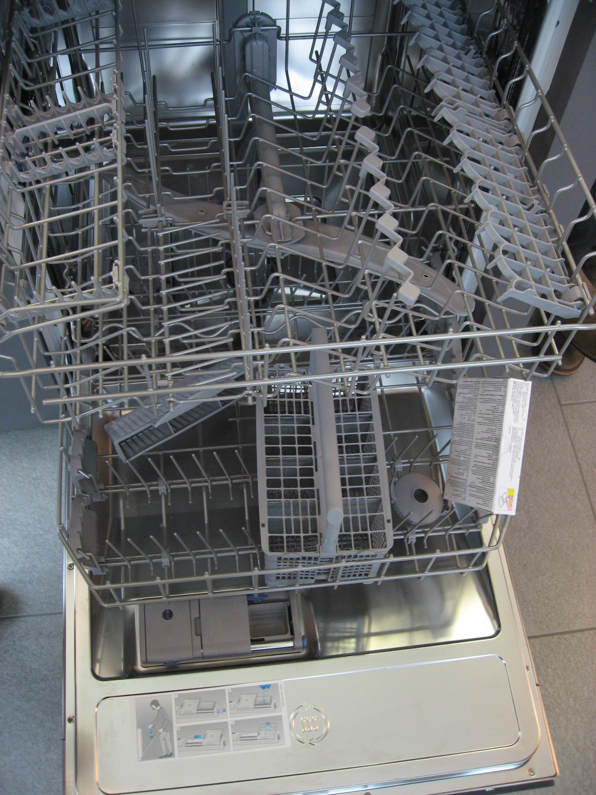 a kitchen dish washer sitting on top of a counter