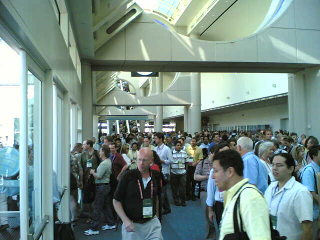 large group of people walking around an indoor mall