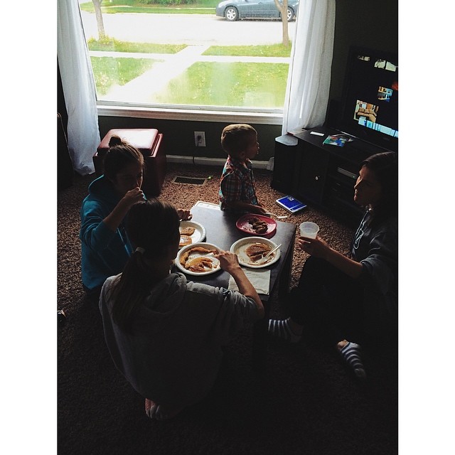 a family having a snack together by the window