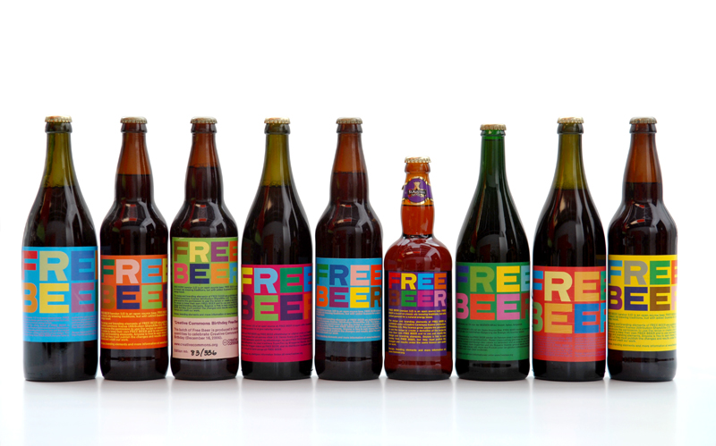 eight beer bottles in a row with the letter befree written on them