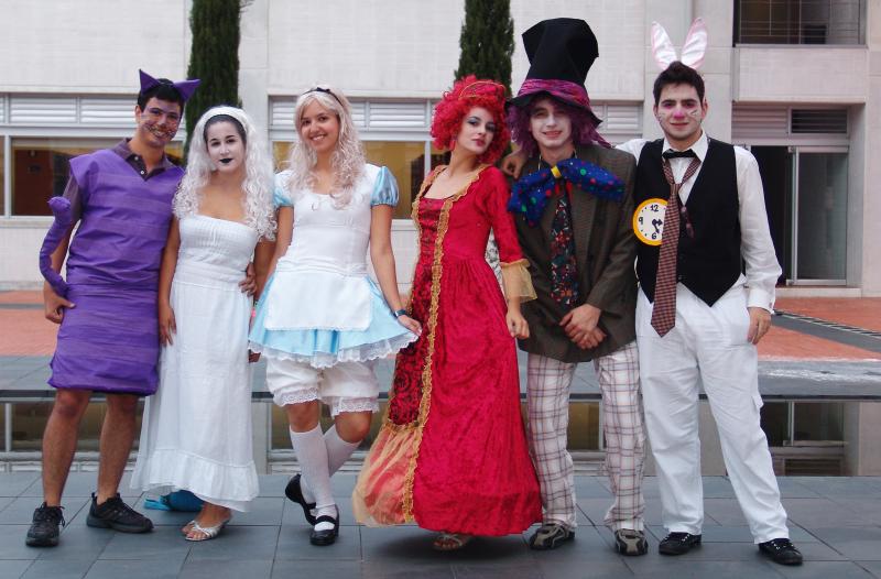 people in costumes and rabbit ears are standing on the ground