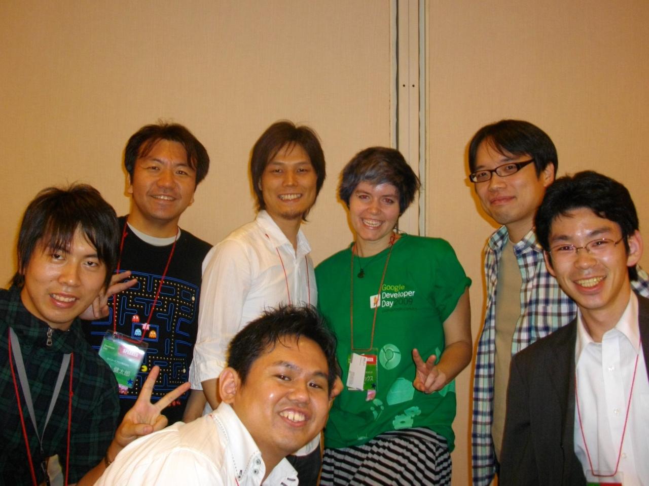 there are six people smiling and standing together