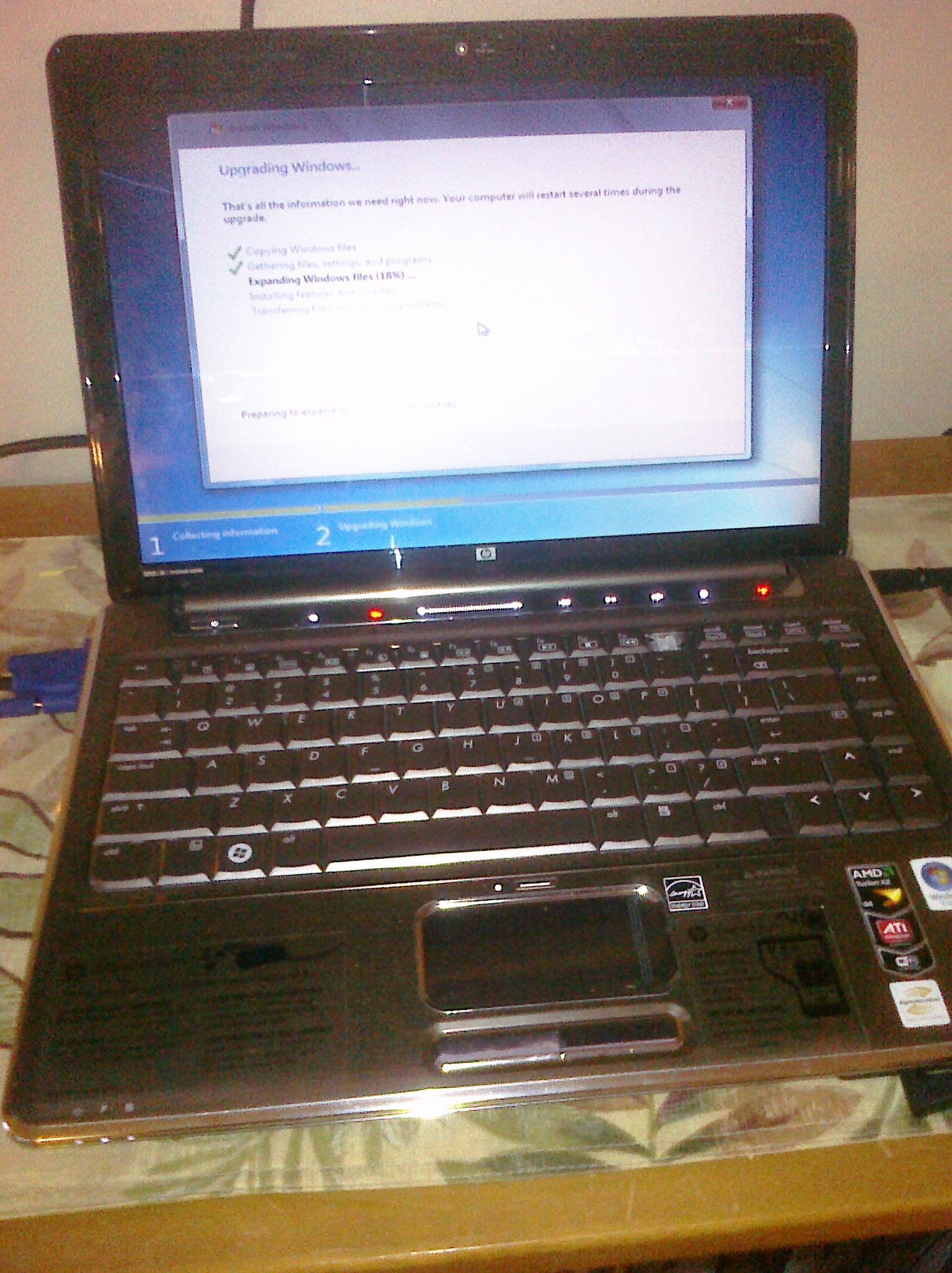 an open laptop with the keyboard missing on a table