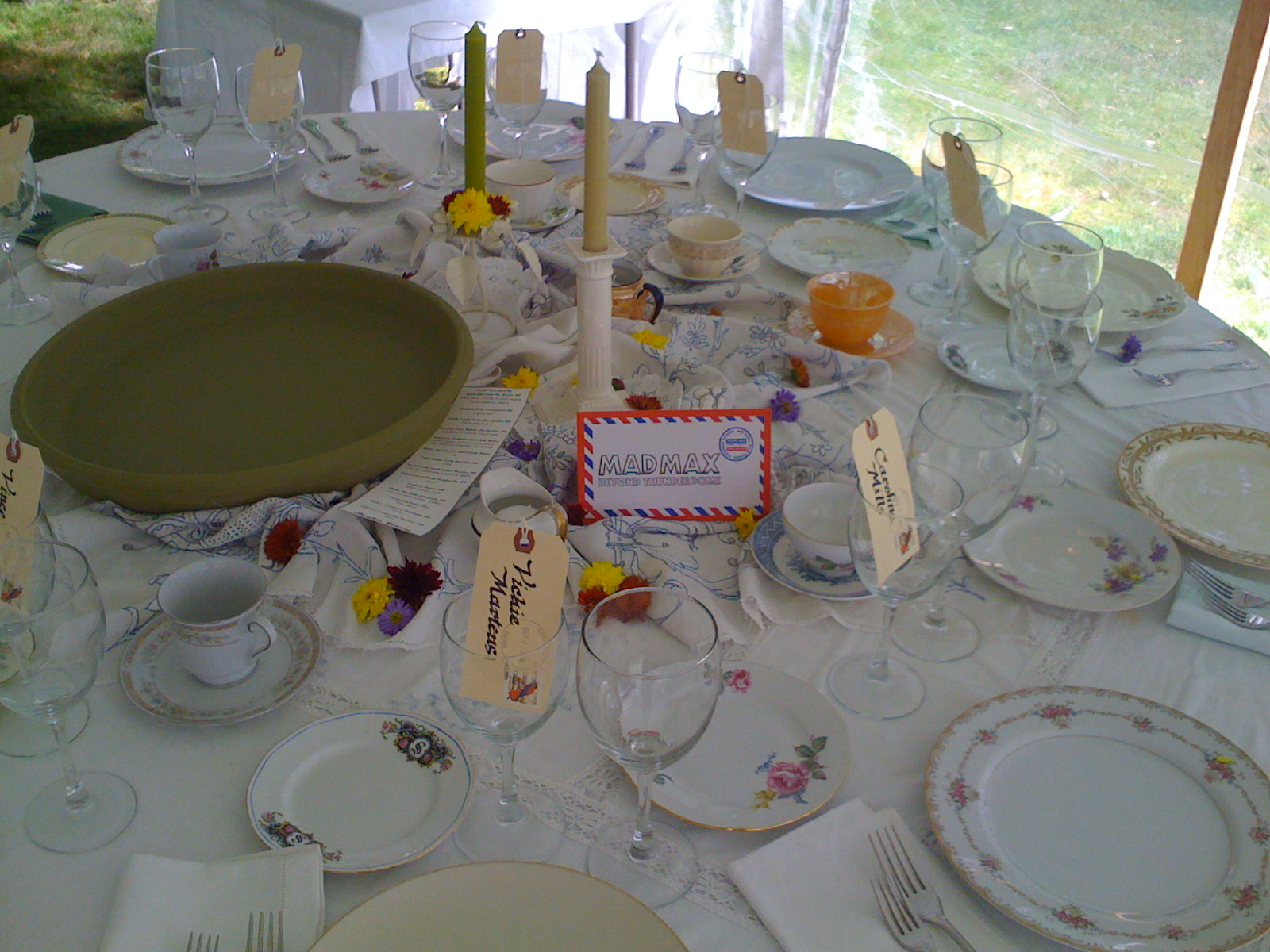 a white table with many plates on it