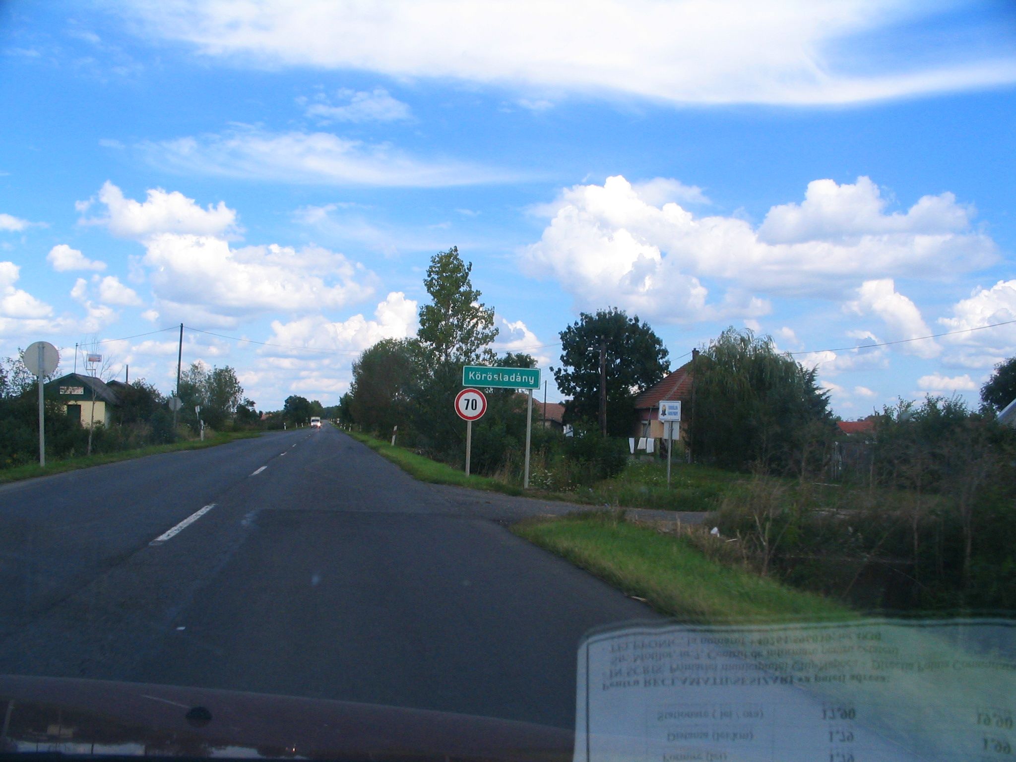 a view of the street from outside a car