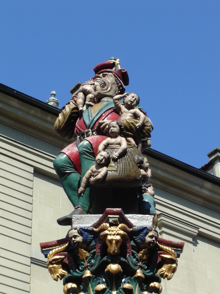 a statue with many animals sitting on it