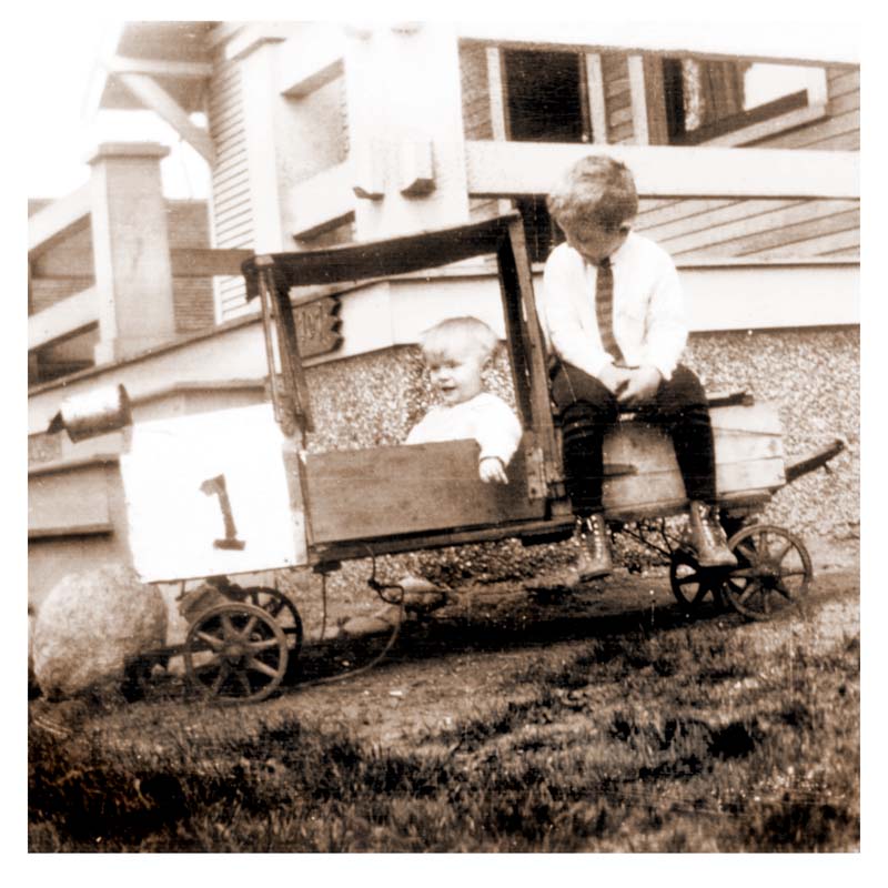 an old po of a person sitting on the top of a wagon