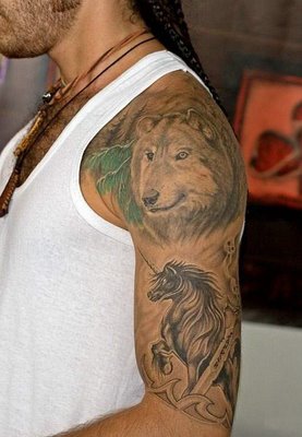 a man with a lion tattoo on his shoulder