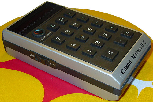 a remote control sitting on top of a colorful object