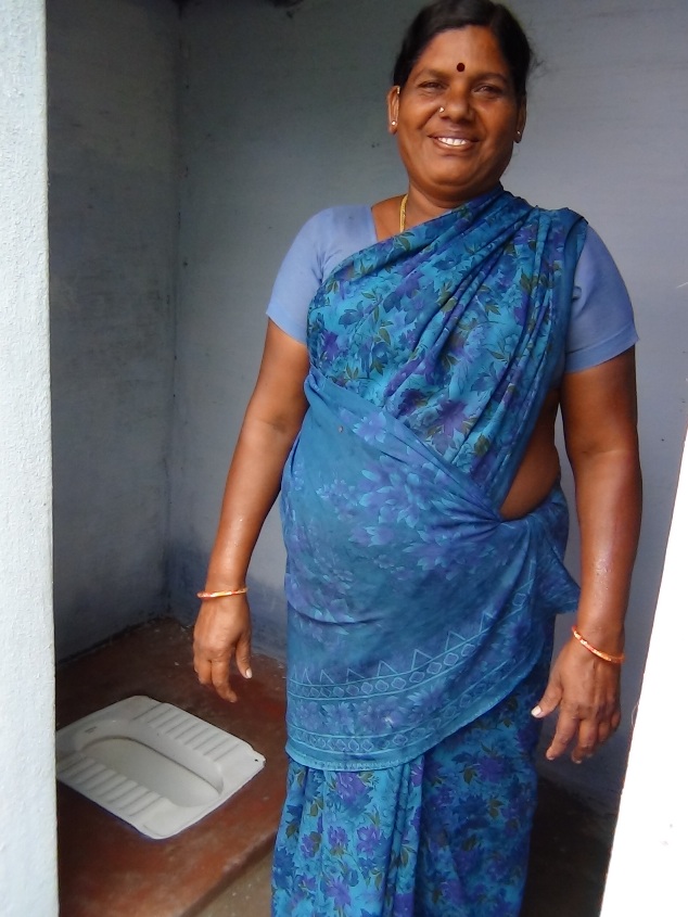 a woman standing inside of a doorway next to a door