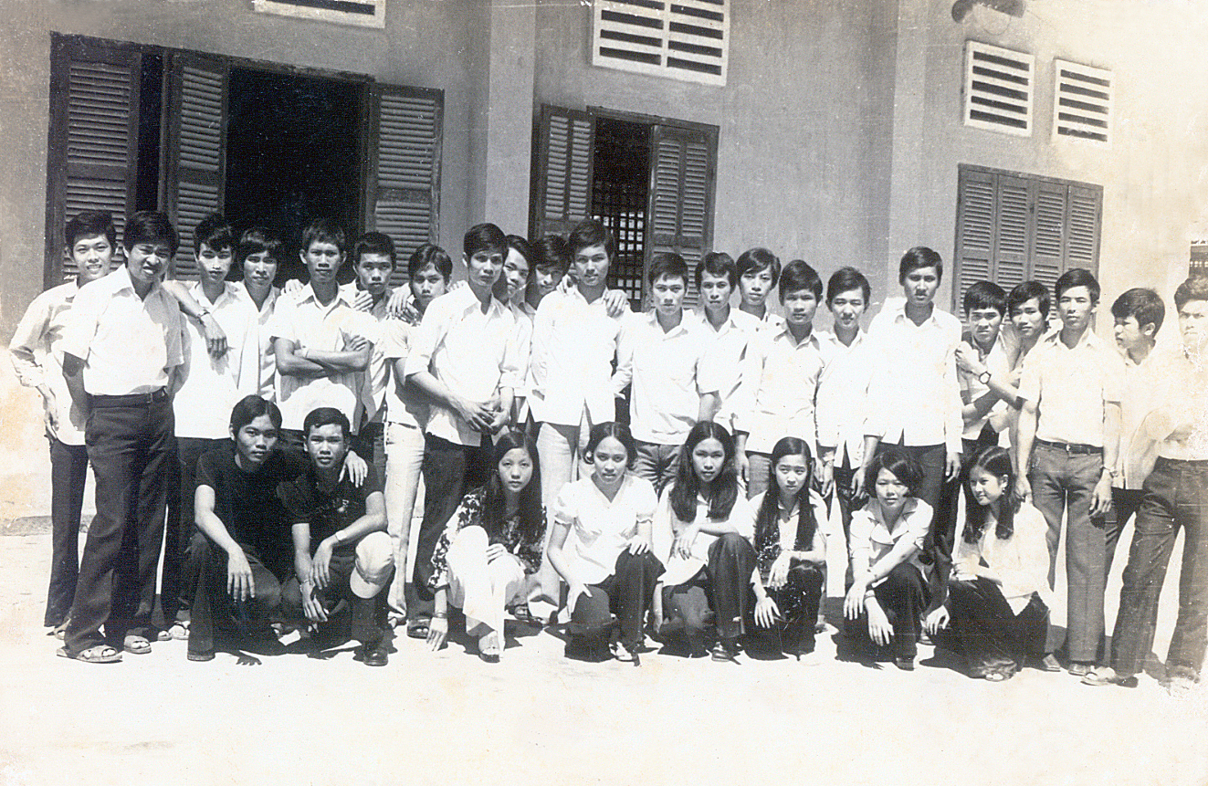 a group po taken in front of an old building