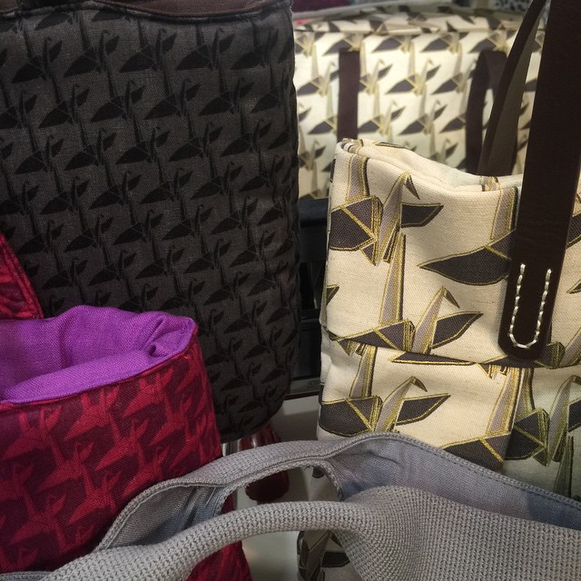 a close up of several bags in various colors