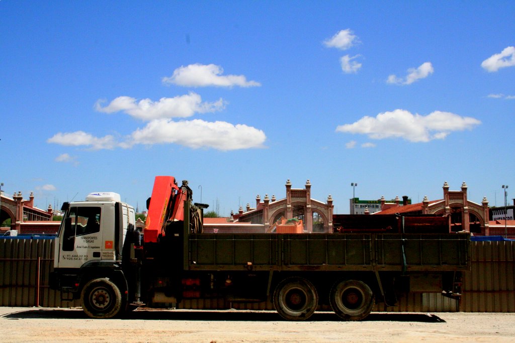 a large truck parked in front of a building