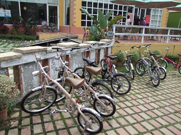several bicycles that are parked in front of some building