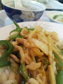white plate with stir fry, onions and green beans