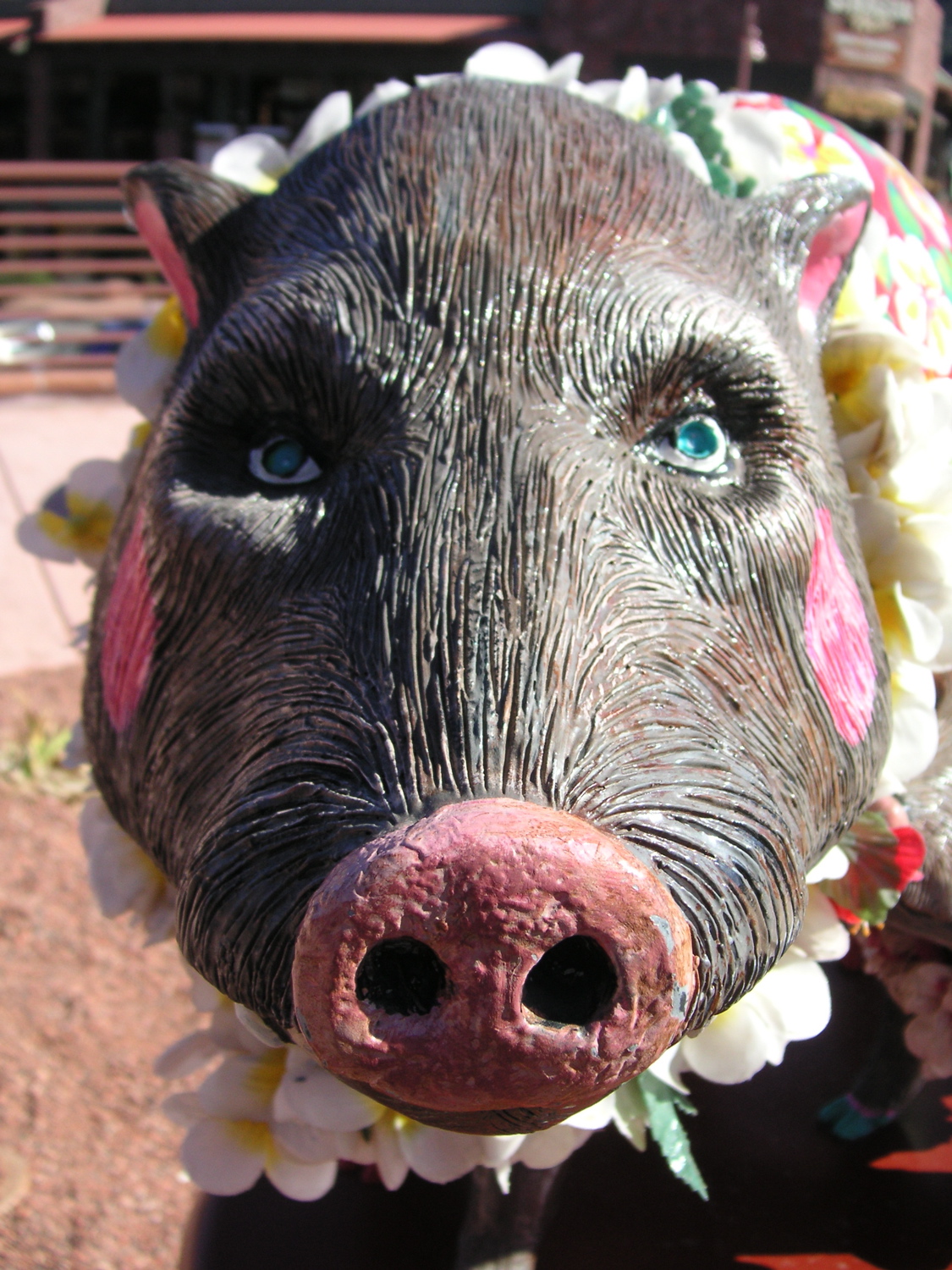 an adorable pig with flowers on it's head