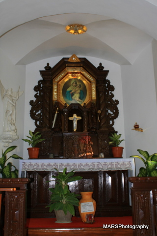 the alter with wooden decorations in front of it