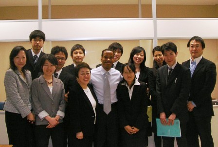 a group of people standing together and posing for the camera