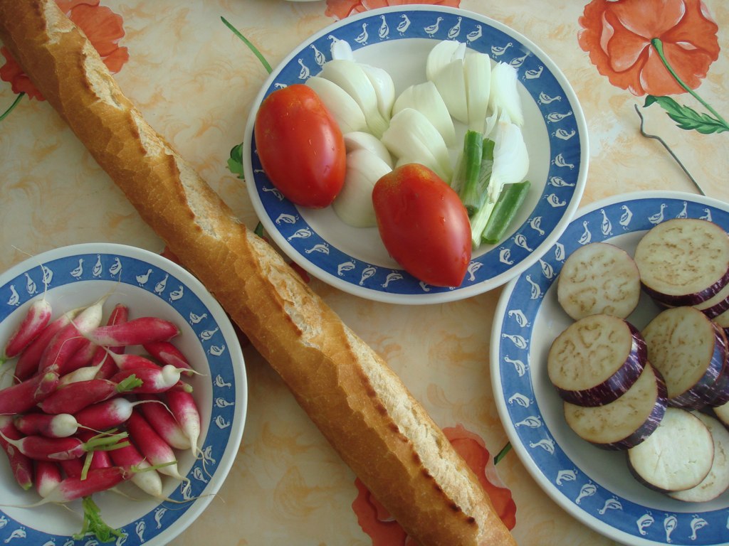 different plates of food displayed on table with flower design