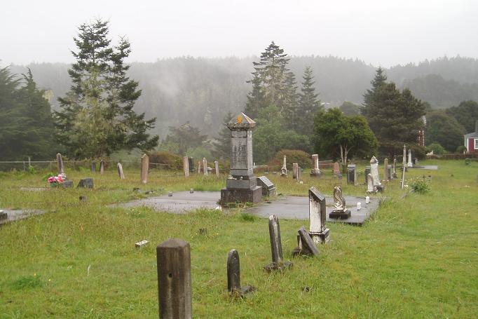 an old cemetery with many headstones and grave markers