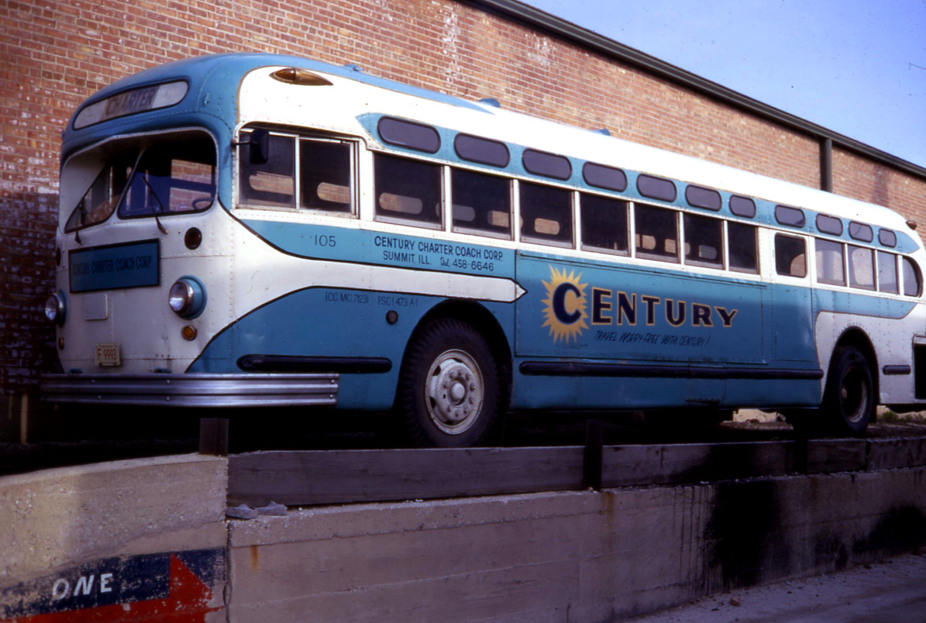 a large blue and white bus is parked