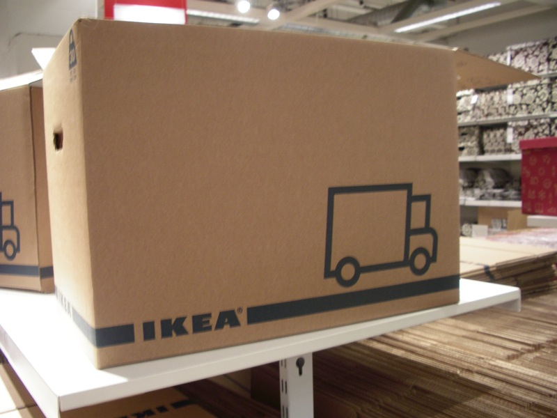 two boxes with the words ikea written on them are sitting on a shelf in the warehouse