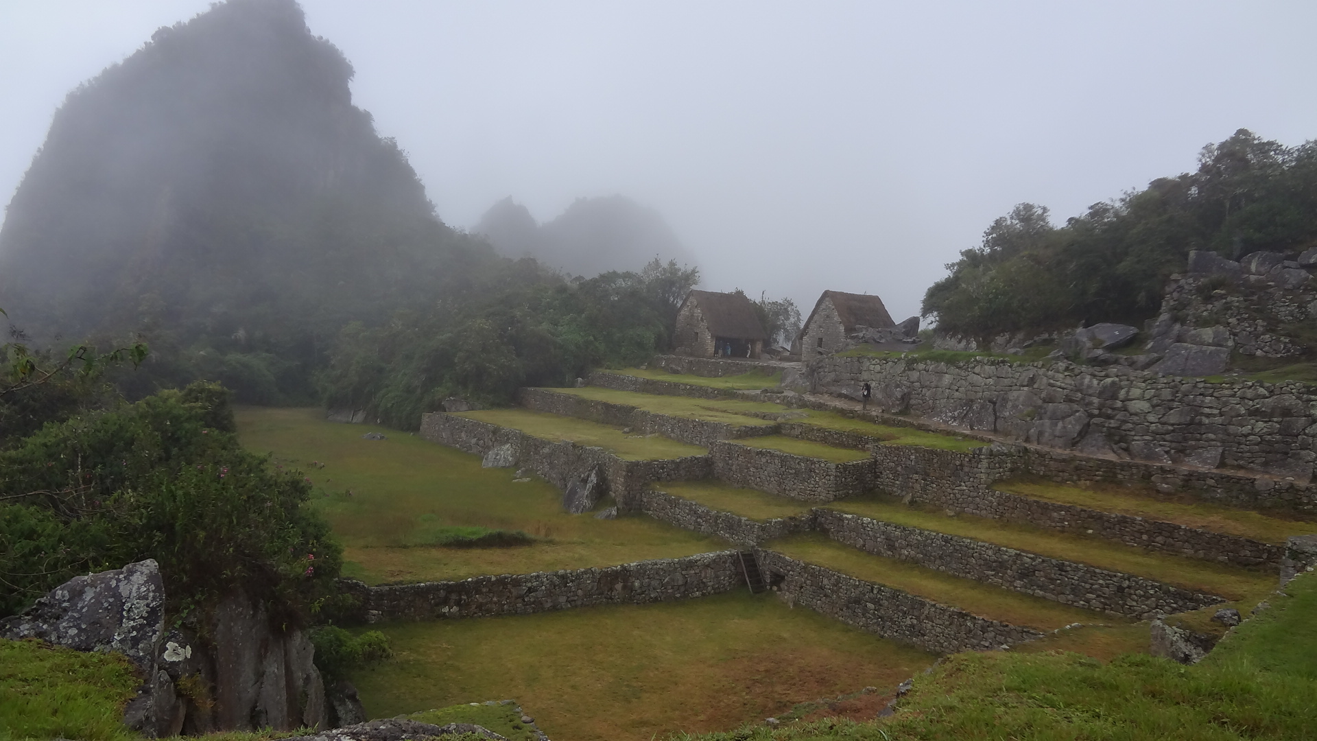 the stone structures have fog covering them