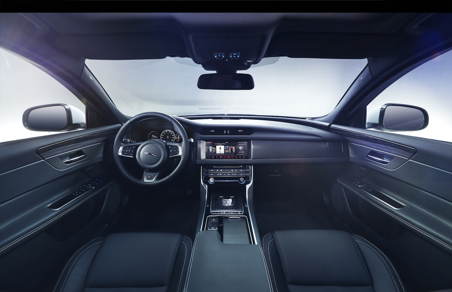 the inside of a car shows the center console and steering wheel