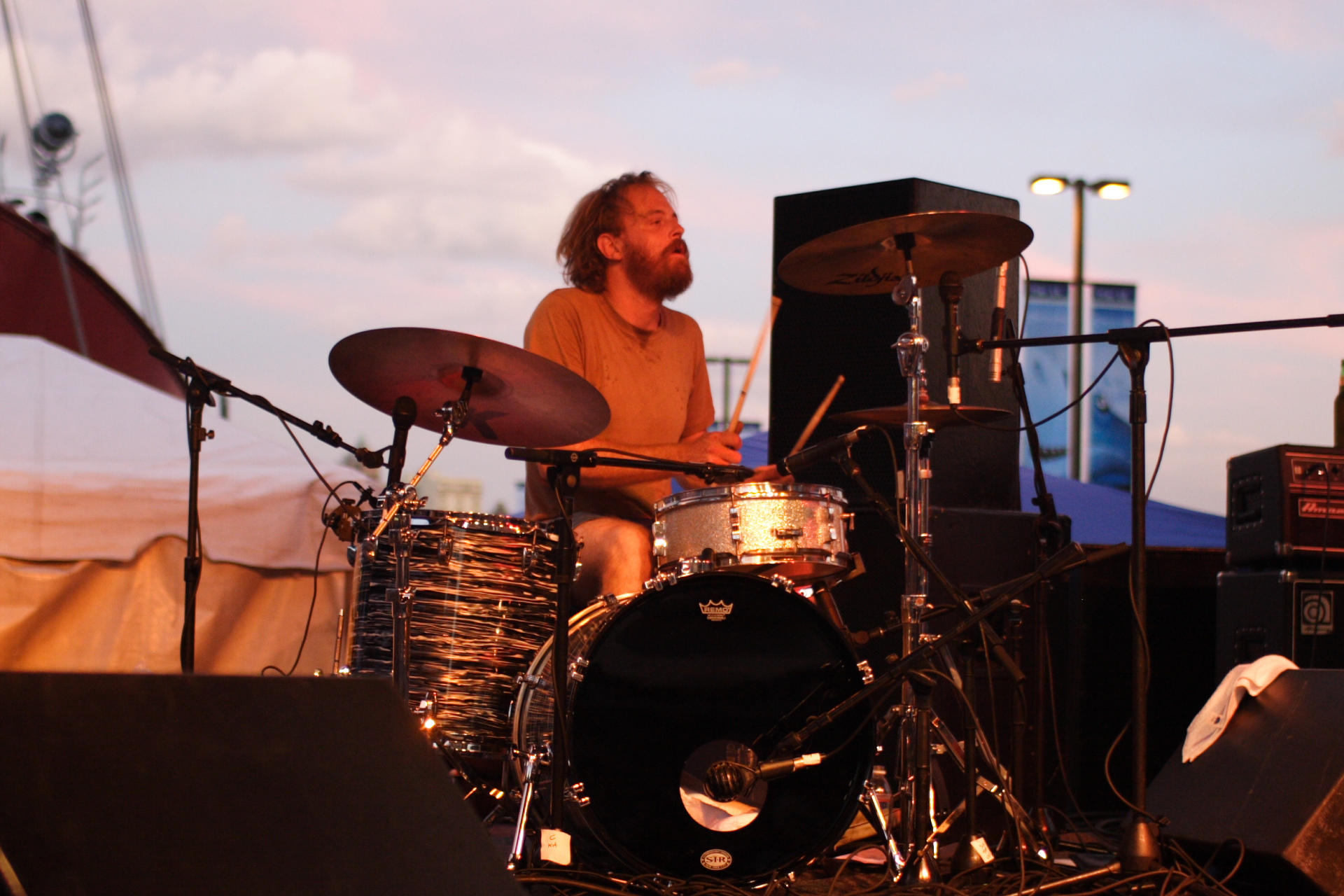 a drummer is on stage with an instrument