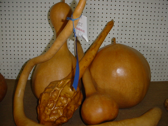 two bananas and an apple made out of wood