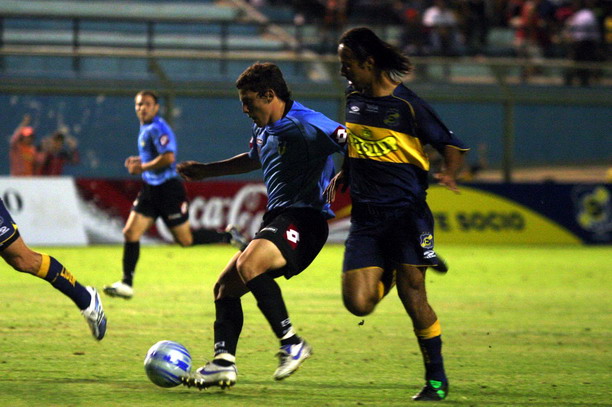 several soccer players are playing a game on the field