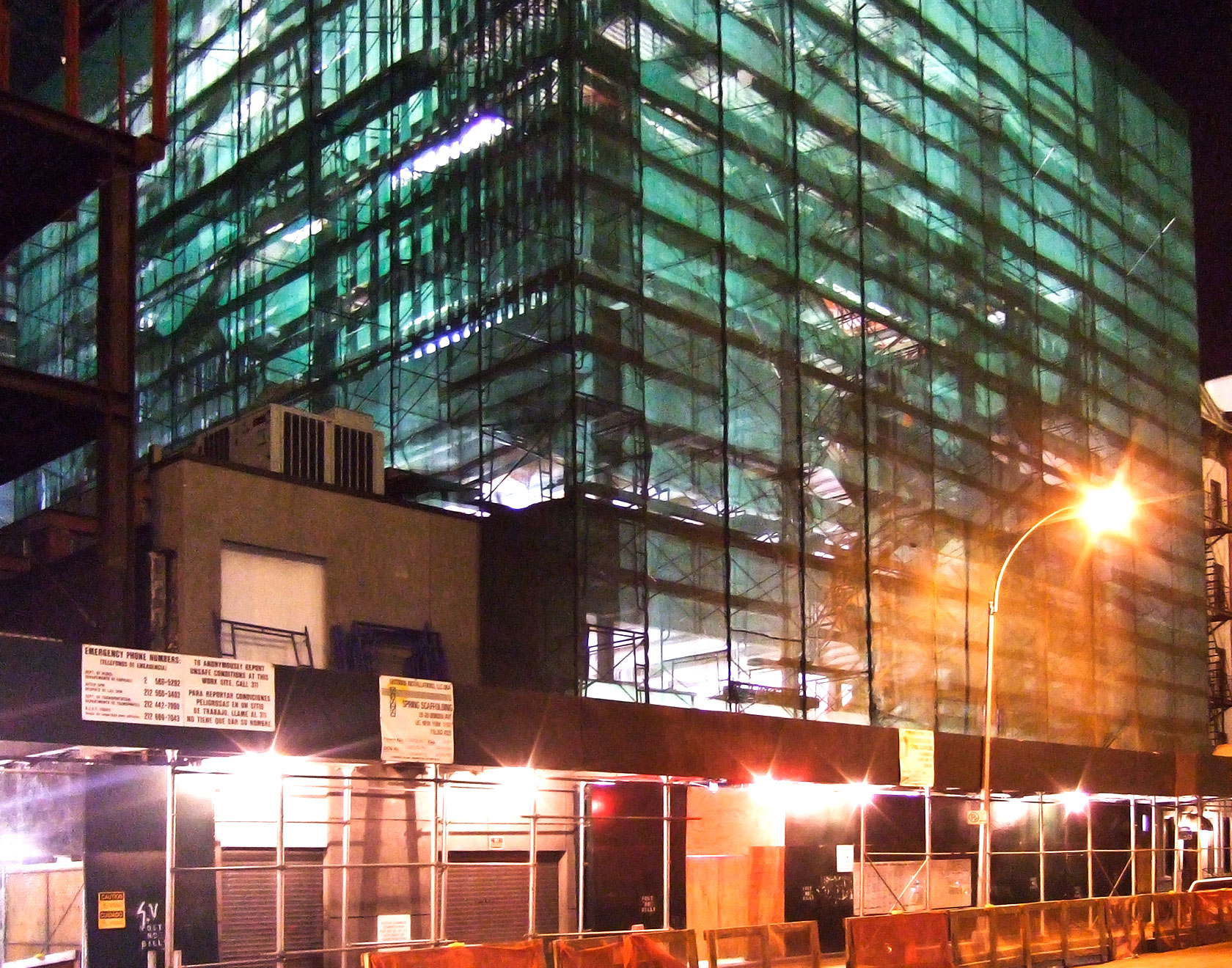 an urban night scene with a large building