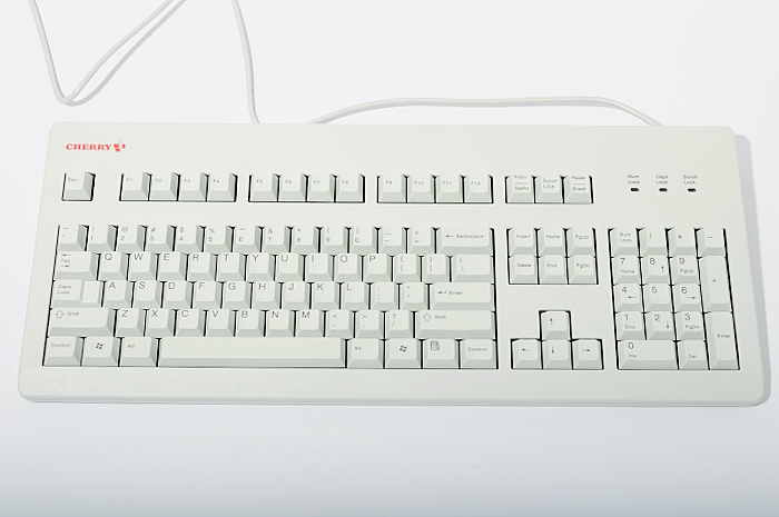 a computer keyboard sitting on top of a table