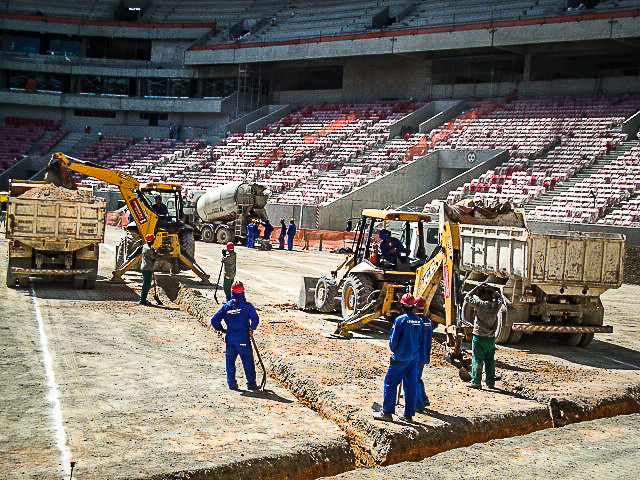 some men work at an arena building construction site