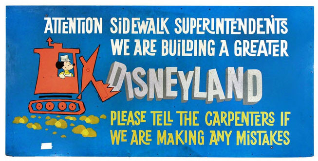disneyland sign with words on blue background