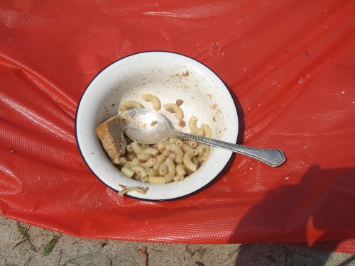 a bowl filled with food sits on a red table