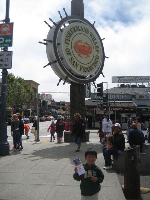 a  standing by a sign that says the crab chain