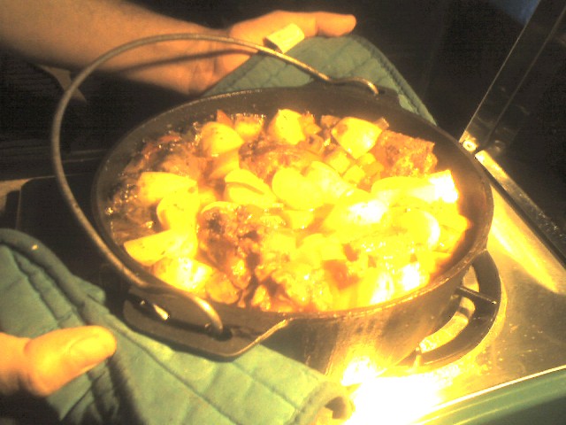 a pan is being cooked with food on a stove