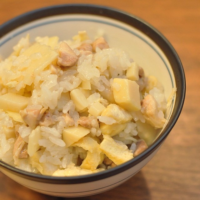a bowl of rice with various types of meats