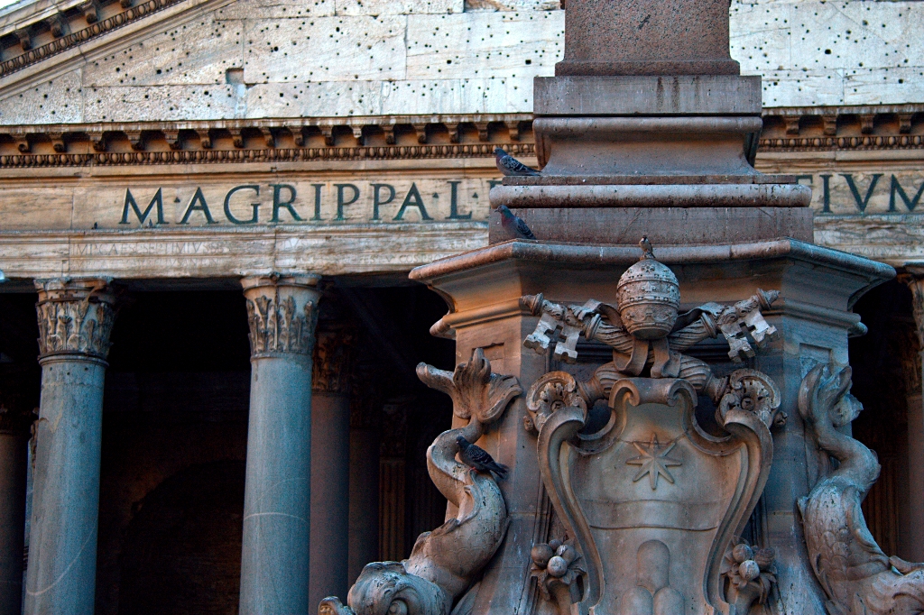 a sculpture of an elephant in front of an ornate building