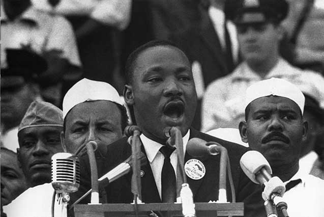 the rev martin luther king at a press conference