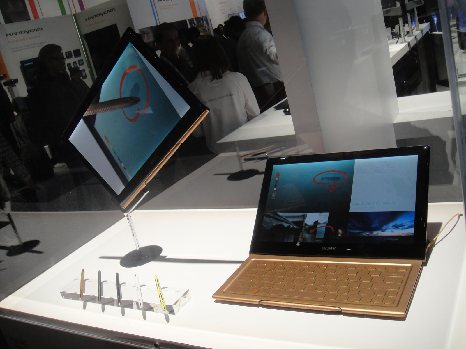 two computer screens on display at a display room