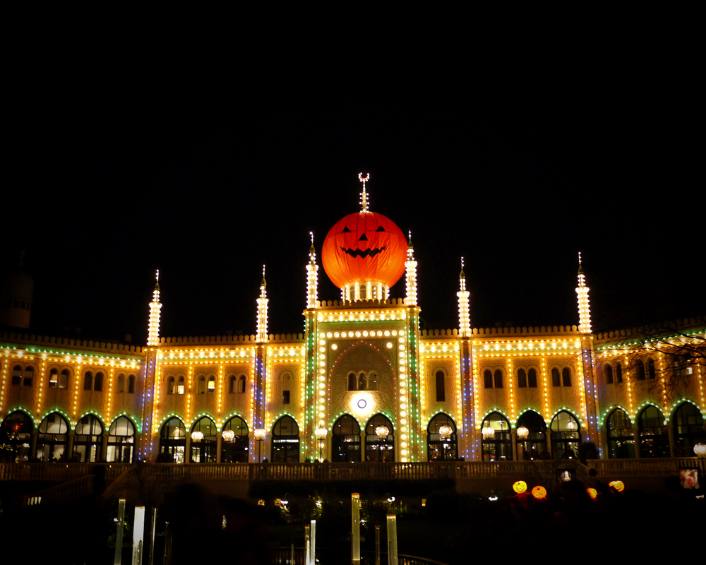 an elaborate building with decorations at night