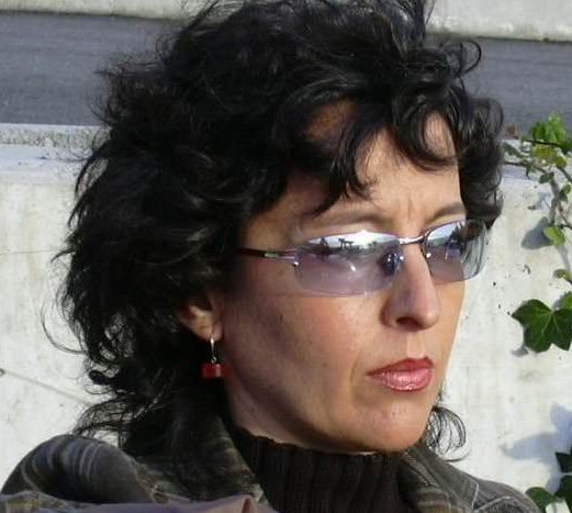 a woman in sunglasses with short hair