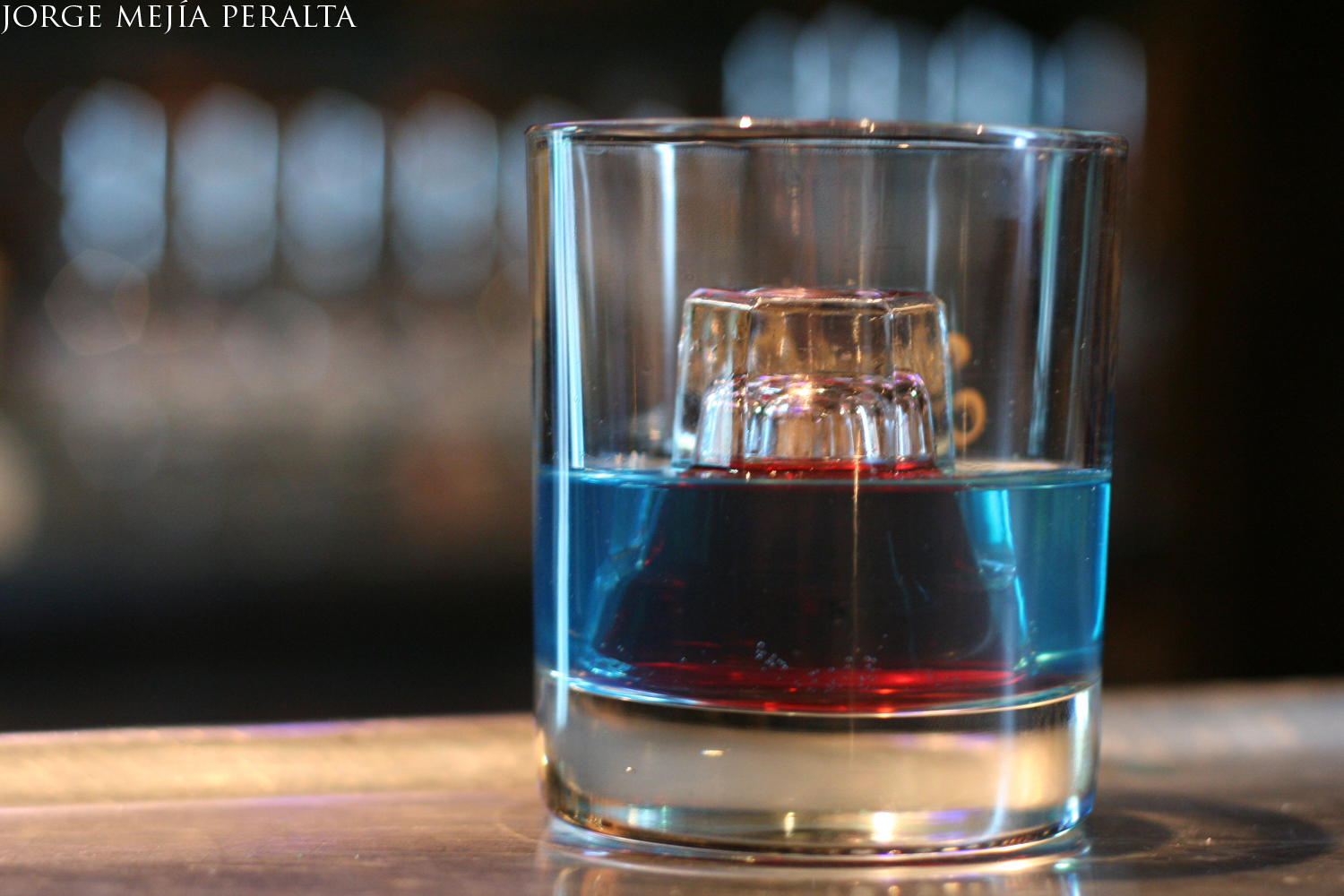 a glass cup with liquid inside of it