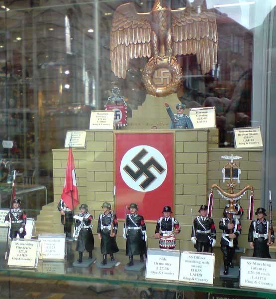 figurines, statues and flags in a shop window