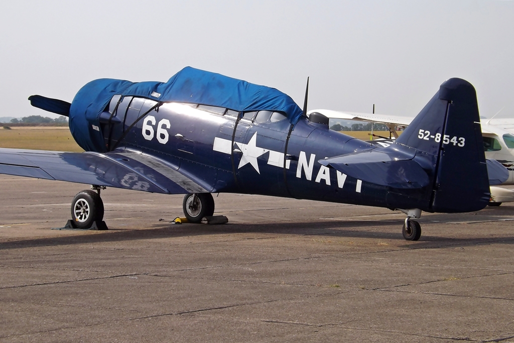 a small plane with no wheels on a tarmac