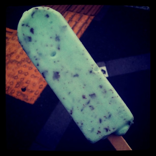 a popsicle with some kind of ice cream on it