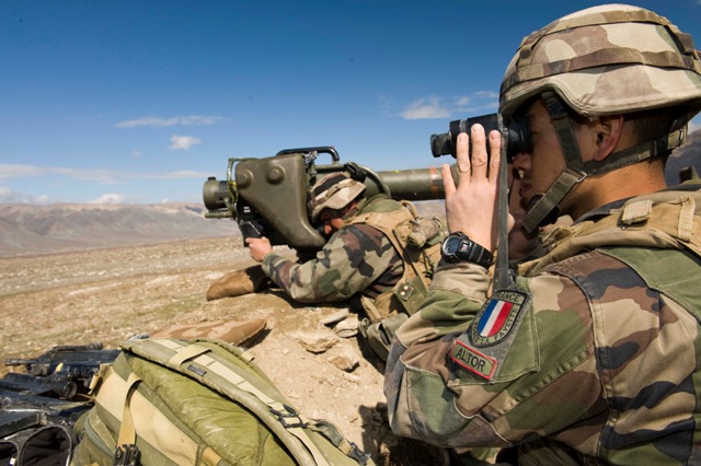 soldier using an m14 gun on the mountain