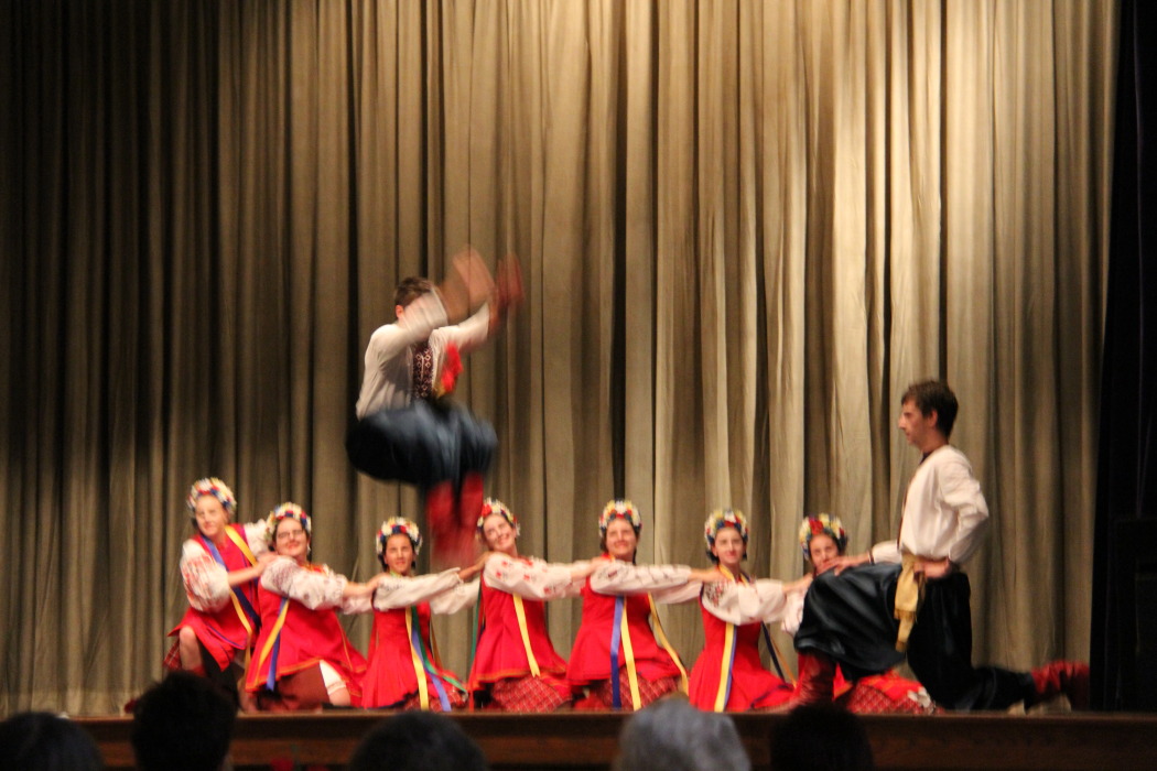 the person is performing a routine on stage